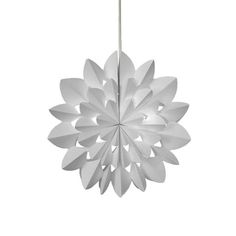 an ornament shaped like a flower on a white background