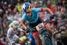 a person riding a bike in front of a crowd