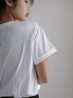 Loose fit cotton t-shirt with rolled sleeve. Simple yet super comfortable. Split detail at hem, round neckline. Model is wearing MINUSEY ONE SIZE. ✔️ Free worldwide express shipping over $100✔️ Loved by 6,500+ customers✔️ Limited edition collections, maximum style⠀⠀⠀⠀⠀⠀⠀⠀⠀Stay ahead of the trend with can’t-find-anywhere-else staples. Your closet will thank you 💕 * MINUSEY ONE SIZE= EU 34-38, US 2-6* 100% Cotton * Dry clean* Made in Korea - Model Height: 171cm/5'7" (US2, EU34) The Trend, Model Height, Sleeve Cotton, Cotton T Shirt, Round Neckline, Chef's Jackets, Cotton Tshirt, Tunic Tops, Split