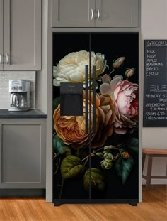 an image of a kitchen with flowers painted on the door and side by side refrigerator