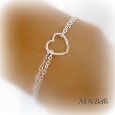 Welcome simple heart bracelet... details: sterling silver cable chain and clasps sterling silver heart measures 10mm from side to side please select desired length at checkout! Custom Orders Welcome! Minimalist Sterling Silver Heart Bracelet For Mother's Day, Silver Minimalist Heart Bracelet For Valentine's Day, Minimalist Silver Heart Bracelet For Valentine's Day, Adjustable Heart-shaped White Gold Charm Bracelet, Adjustable Delicate Sterling Silver Heart Bracelet, Dainty Sterling Silver Heart Bracelet, Minimalist Silver Sterling Heart Bracelet, Dainty Heart-shaped Sterling Silver Bracelet, Adjustable Double Heart Sterling Silver Charm Bracelet