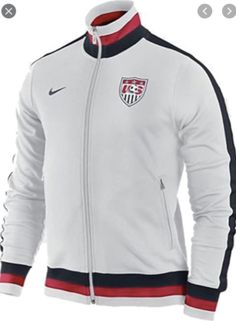 Classic white Nike US Soccer track jacket in red white and blue White Hooded Varsity Jacket With Ribbed Cuffs, Nike White Hooded Track Jacket, Sporty Team-colored Track Jacket For Sports Season, Nike Outerwear For Sports Events, Sports Track Jacket With Side Stripes, Sporty Track Jacket For Sports Season, White Long Sleeve Track Jacket For Sports Season, White Long Sleeve Track Jacket For Sports, Team-colored Track Jacket For Sports Season