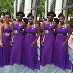 a group of women in purple dresses standing next to each other on a stone floor