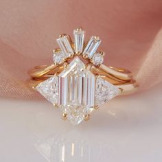 an engagement ring with three baguets on top