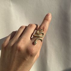 14k Solid Gold Snake Ring | Certified Solid Gold Serpent Ring, Witchcraft Jewelry, Gift for Her 14k Solid Gold Snake Ring 🐍 - The ring is made of certified 14k Solid Gold (585) - The ring is adjustable by hand which can fit on all types of fingers - Easy to wear / Lightweight - Detailed Engraving Historically, serpents and snakes represent fertility or a creative life force. As snakes shed their skin through sloughing, they are symbols of rebirth, transformation, immortality, and healing. ● Pur Symbolic Gold Snake Jewelry, Fine Jewelry Brass Promise Ring, Luxury 14k Gold Snake-shaped Ring, Fine Brass Jewelry For Promise Ring, Luxury Snake-shaped Jewelry For Anniversary, Snake-shaped Engraved Jewelry Gift, Heirloom Gold Snake Ring For Promise, Yellow Gold Snake-shaped 14k Gold Rings, Unique Tarnish Resistant 14k Gold Jewelry