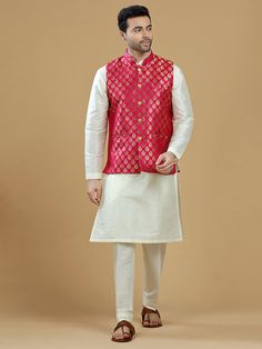 A gold zari brocade vest to pair with any kurta with statement button closures at the front. Occasion: Style this vest with pajama pants and a kurta for a welcome dinner or sangeet night, or style it with a any dress shirt and trousers for a sleek Indian wedding reception look! WASH CARE INSTRUCTIONS - Please Dry clean only. Slight color variation is possible due to digital photography. **Kurta & Pajama not included Pink Nehru Jacket For Festive Occasions, Festive Pink Nehru Jacket Straight Kurta, Pink Nehru Jacket With Zari Work For Festive Occasions, Pink Nehru Jacket Straight Kurta For Diwali, Pink Nehru Jacket For Diwali, Sleeveless Bandhgala For Eid, Festive Pink Nehru Jacket With Zari Work, Sleeveless Kurta With Pallu For Navratri, Bollywood Style Pink Nehru Jacket For Festive Occasions