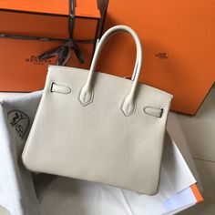 Description HRMS Birkin Cream With Gold Hardware Bag For Women, Handbags, Shoulder Bags 30cm/12in Rep 1:1 Size: 30 x 23 x 17 cm / 12 x 9 x 6.5 inches (Length x Height x Width) Hermès bags are considered the ultimate luxury item the world over. Hand stitched by skilled craftsmen, wait lists of a year or more are common. Epsom Birkin bag will retain its shape immaculately, with the same scratch-resistant qualities as popular Togo. We love the combination of gold hardware with the uplifting classic Gold Tote Bag, Togo Leather, Women Bags Fashion, Hermes Bags, Bag For Women, Hermes Birkin, Birkin Bag, Kate Spade Top Handle Bag, Hand Stitched