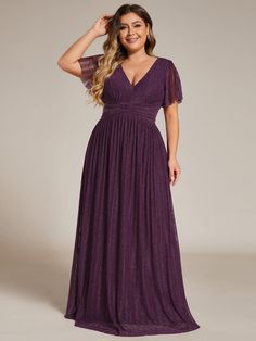 a woman in a long purple dress