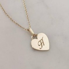 Monogram heart necklace. Vintage style heart pendant engraved with your initial. A perfect gift to be cherished forever.   Heart pendat: 11 mmPendant thickness: 1 mmNecklace length: 45 cm* Available in 14K or 18K YELLOW, WHITE and ROSE gold.price listed is for 14K gold (for 18k pricing please contact me)* Available in either shiny or matte finish. Please choose your preferred finish upon checkout.* Please mention the initial you would like engraved in "note to seller" * For a longer necklace (50 Custom Sterling Silver Necklace With Engraved Heart Pendant, Engraved Heart Name Necklace For Anniversary, Classic Round Pendant Necklace For Valentine's Day, Custom Engraved Sterling Silver Necklace With Heart Pendant, Custom Engraved Sterling Silver Heart Pendant Necklace, Heart-shaped Wedding Necklace With Engraving Option, Heart Shaped Wedding Necklace With Engraving Option, Silver Heart Pendant Initial Necklace, Heart Pendant Necklace With Engraving Option For Wedding