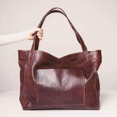 Introducing our Oil Wax Vegan Weekender Tote Bag – a must-have accessory that's in high demand! With an oil wax finish, this tote is available in black, cognac, and burgundy, offering a perfect size for everyday use, weekend getaways, or shopping.Crafted from vegan leather, it features an oil wax look and feel that adds a touch of sophistication. Measuring 16 inches by 12.6 inches, with a 5-inch gusset, this tote strikes the ideal balance between style and practicality.Elevate your fashion with Vacation Tote Bag, Luxury Leather Bag, Soft Leather Tote, Pu Leather Bag, Vintage Shoulder Bag, Casual Tote, Tote Bag Leather, Retro Stil, Shoulder Tote Bag