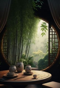 a table with two cups and saucers on it in front of a bamboo forest