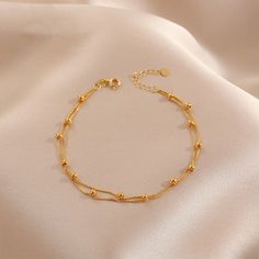 Name: Double layer small round bead bracelet Size: 15+5cm Material: titanium steel Weight: 5 grams Color: gold Product maintenance: Keep away from chemicals, avoid scratches, do not wear in contact with water, do not wear while sleeping, seal and store, do not put together with anti-oxidation paper Regarding color difference: Each picture is taken from the actual object. Due to various reasons such as computer monitor restoration, shooting background, light angle, etc., the color you see in the Bracelets Gold Simple For Women, Gold Bracelet Simple, Jewelry Product Shots, Background Light, Jewelry Set Design, Gold Necklace Indian Bridal Jewelry, Bracelets Design, Gold Chain With Pendant, Dress Indian