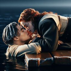 two people kissing each other in the water