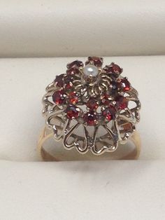 "Antique/Vintage 14K Yellow Gold Garnet and Pearl Princess Harem Style Ring.Size 5 1/2. Weight 3.7 grams. Please note the shipping cost in the listing is for US only. Please do not pay if you live outside the state unless you have first contact me for the correct shipping cost to your country. Also be aware that there may be extra charges for import duties, VAT and a handling charge -all of which I have no control over. Condition: From my perspective it looks very good. No damage to note. Items Antique 14k Stamped Ruby Wedding Ring, Vintage Hallmarked Yellow Gold Cluster Ring, Vintage Yellow Gold Cluster Ring, Vintage Multi-stone Ruby Ring Gift, Vintage Multi-stone Ruby Ring For Gift, Vintage 14k Gold Cluster Ring Hallmarked, Vintage 14k Gold Ruby Ring, Vintage Gold Cluster Ring With Gemstones, Vintage Ruby Ring With 17 Jewels For Wedding