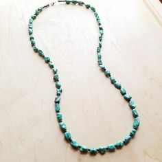 We've got heart eyes for this long turquoise necklace! This long boho necklace is made up of natural turquoise chunks and small wooden beads. This turquoise stone necklace is the perfect item to layer with shorter necklaces and boho statement necklace as shown in the attached pictures. Add this turquoise stone necklace to your unique handmade jewelry collection! Although your handmade beaded necklace will resemble the photo, each piece is created by hand, so no two are identical. Length: 38 inch Cheap Adjustable Turquoise Beaded Necklace, Long Turquoise Necklace, Chunky Turquoise Necklace, Long Boho Necklace, Boho Chic Accessories, Turquoise Beaded Necklace, Long Necklace Boho, Boho Statement Necklace, Handmade Beaded Necklace