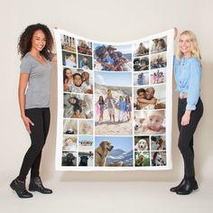 two women standing next to each other holding up a large blanket with pictures on it