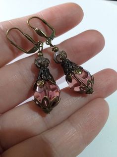 Victorian Burgundy bronze earrings Edwardian earrings bronze earrings Boho Earrings Bohemian earrings antique earrings Filigree drop earring Beautiful Victorian filigree antique style bronze and Burgundy glass beads earrings . Drop earrings . Dangle earrings . Boho earrings . Bohemian earrings . Burgundy  glass beads and  bronze fine ornaments  Boho earrings . Vintage style earrings . Filigree earrings .   We have a same style jewelry set with necklace, shown on the last pictures. FREE SHIPPING  Material :  bronze ornaments beads, glass beads,  Length with hooks : 2.20 ( 5,5 cm) If you have any question, please contact me ! Thank you for visiting my shop ! If you have a RUSH ORDER and you want to pay for FAST SHIPPING by DHL - 3-5 business days is HERE :  https://www.etsy.com/listing/91480 Antique Finish Bronze Wedding Earrings, Victorian Bronze Pierced Earrings, Victorian Style Bronze Pierced Earrings, Antique Drop Earrings With Antique Finish, Antique Style Drop Earrings With Antique Finish, Vintage Dangle Crystal Earrings As Gift, Vintage Dangle Crystal Earrings For Gift, Nickel-free Vintage Drop Crystal Earrings, Antique Brass Drop Plug Earrings