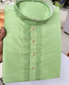 Pista Green Boy's Kurta Pajama. Silk Kurta with Shine Perfect for Partywear Beautiful Aari work embroidery on Kurta neck. White Cotton Pajama With Buttons on Kurta, Full Sleeves. Wash Care: Kurta (Top): Dry Clean Recommended. Pajama (Bottom): Mild machine washing or cool hand washing. Disclaimer-: Product color may differ slightly from the image. Contact us for any bulk orders. Please note that we offer expedited shipping, which only speeds up the shipping time, our processing time will not be affected. Check out our other Kids' wear  https://www.etsy.com/shop/ClassicIndianFashion?ref=seller-platform-mcnav&section_id=36943626 Check out Men's Kurta Pajama https://www.etsy.com/shop/ClassicIndianFashion?ref=seller-platform-mcnav&section_id=28320975 Also, check our store at the following link- Traditional Drape Kurta In Pista Green For Transitional Season, Pista Green Traditional Drape Kurta For Transitional Season, Pista Green Raw Silk Kurta For Transitional Season, Green Raw Silk Straight Kurta Bandhgala, Festive Green Raw Silk Bandhgala, Transitional Pista Green Raw Silk Kurta, Transitional Traditional Drape Pista Green Kurta, Pista Green Chanderi Bandhgala For Eid, Eid Raw Silk Kurta With Cutdana