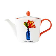 a teapot with a flower in it on a white background and an orange handle