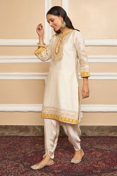 Daisy ivory short kurta with Kashmiri tilla, gota applique embroidered yoke in floral pattern. Paired with dhoti pant. - Aza Fashions Off White Pallu Set With Straight Kurta, Traditional Off White Sets For Diwali, Traditional Off White Set For Diwali, Traditional Off White Salwar Kameez With Dabka, Traditional Fitted Beige Palazzo Set, Cream Dabka Sets For Diwali, Off White Dabka Sets For Festivals, Beige Fitted Traditional Palazzo Set, Cream Sets With Dabka For Diwali