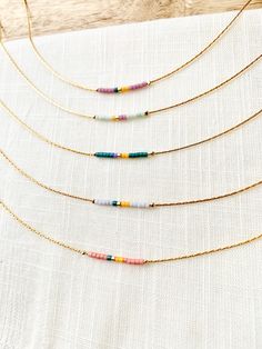 🌈 Thin gold plated chain with tiny Japanese seed beads in happy, bright colors. Choose between Gold Plated or Gold Filled materials. What's the difference? Gold filled materials contain 100x more real gold than the gold plated option and are very durable, tarnish resistant and will last for years. 📏Not sure which length to choose? Add a chain extender: https://etsy.me/34lPf3m To view more items from this shop, click the link below: https://www.etsy.com/shop/OceanBreakup 🌎 Packaging 🌎 To be e Colorful Beaded Necklace, Sundance Jewelry, Wire Jewelry Rings, Necklace Packaging, Bracelets Handmade Diy, Beaded Necklace Designs, Beaded Necklace Diy, Gold Bead Necklace, Jewelry Studio