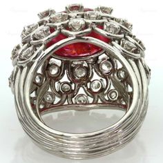 For Sale on 1stdibs - This captivating ring from David Webb features an open-design dome crown prong-set with an oval 11.0mm x 15.0mm cabochon ruby and surrounded by 36 sparkling Luxury Ruby Ring With Oval Cabochon And Polished Finish, Luxury Ruby Dome Ring, Luxury Ruby Ring Oval Cabochon With Polished Finish, Luxury Ruby Oval Cabochon Ring, Luxury Ruby Cabochon Diamond Ring, Azurite Malachite, David Webb, Ruby Diamond Rings, Coral Ring