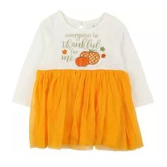 New With Tags Baby Girls Thanksgiving Dress Size 12 Months 18-23 Pounds 3 Dresses Available. Perfect For Twins Or Triplets. Get Your Little One Ready For The Holiday Season With This Adorable Baby Essentials T-Shirt Dress. Featuring A Cute Pumpkin Pattern And The Phrase "Everyone Is Thankful For Me", This Knee-Length Dress Is Perfect For Thanksgiving Festivities. The Dress Has Long Sleeves And A Round Neckline With Button Closure. Made From A Comfortable Cotton Blend Material, This Dress Is Machine Washable For Easy Care. The Tulle Skirt And Embroidered Accents Add A Special Touch To This Dress, Making It A Great Addition To Your Baby Girl's Wardrobe. Free Shipping Fall Playtime White Dress, Yellow Long Sleeve Dress For Playtime, Cute White Dresses For Fall, Yellow Cotton Dress For Fall, Cute White Fall Dresses, Cute White Cotton Tutu Dress, Cute Yellow Tutu Dress For Spring, Tulle Pumpkin, Thanksgiving Festivities