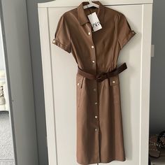 New Never Worn. Not My Color. Can’t Return Leather Midi Dress For Work, Chic Brown Dress With Buttons, Leather Midi Dress For Fall, Chic Leather Midi Dress For Workwear, Chic Brown Mini Dress With Pockets, Chic Fitted Brown Midi Dress, Brown Workwear Dress With Pockets, Chic Brown Fitted Midi Dress, Brown Spring Dress With Pockets