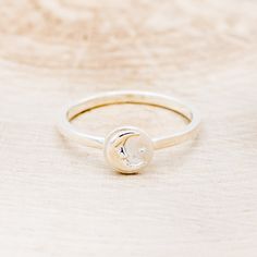 Product Details Ring Style: A celestial-style ring featuring a crescent moon and a star. This ring is pictured in silver. Width: The width of the ring pictured is approximately 2mm wide. Top Dimension: 7.34 mmx7.34 mm Available In: Silver, 14K White Gold, 14K Yellow Gold, 14K Rose Gold Each of our rings is a one-of-a-kind piece and is made to order for you and your significant other by a passionate and skilled artisan. | Celestial Ring Featuring A Crescent Moon & A Star - by Staghead Designs - S Mystical Crescent Rings With Moon Charm, Celestial Everyday Adjustable Rings, Adjustable Celestial Rings For Everyday Wear, Mystical Crescent Moon Charm Rings, Everyday Adjustable Celestial Rings, Adjustable Moon Shaped Celestial Rings, Adjustable Moon-shaped Celestial Rings, Moon Shaped Rings With Moon Charm For Anniversary, Celestial Crescent Moonstone Ring