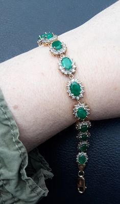 Absolutely Stunning 14k Gold, Diamond Emerald Flower design Bracelet .. Natural  Columbian Emerald in beautiful  bright green  color. WOW  Look Spectacular,  perfect Vintage Pre Owned Condition.  All sales are final,  no return.  Some Pics ENLARGED to see details. ATTENTION BUYERS ALL ITEMS FROM MY SHOP MUST BE PURCHASED STRAIGHT THRU ETSY.COM WEBSITE ONLY,  NOT THRU OFFSITE ADDS GOOGLE AND OTHERS  All orders purchasing from Google and others will be cancelled  NOT SELLING TO BUYERS THRU  ETSY APP  Etsy charging me $100 extra fee from each order, if item sold FROM OFF-SITE ADS, Including Etsy App ONLY ETSY.COM WEBSITE Luxury Green Oval Bracelet, Green Emerald Bracelets For Formal Occasions, Green Emerald Bracelets For Formal Events, Green Formal Bracelet Jewelry, Formal Green Emerald Bracelets, Green Jubilee Bracelet For Wedding, Green Gemstone Bracelet Fine Jewelry, Luxury Green Emerald Bracelets, Green Formal Bracelets In Fine Jewelry Style