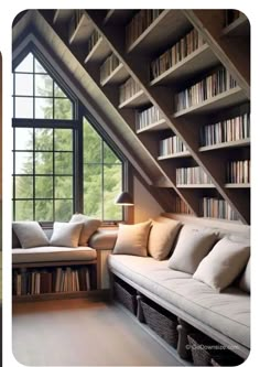 a room with bookshelves and couches in it, next to a window filled with books