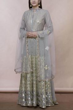 Grey floor-length anarkali with all over mirror embroidery. Comes with matching dupatta.
Components:2
Mirror embroidered
Neckline:Mandarin collar
Sleeve Length:Full
Fabric:Georgette
Color:Grey
Split neckline
Embroidered dupatta with lace - Aza Fashions Lehenga Bollywood, Anarkali With Dupatta, Silk Anarkali Suits, Floor Length Anarkali, Embroidered Anarkali, Lehenga Wedding, Lehenga Collection, Embroidered Neckline, Anarkali Suits