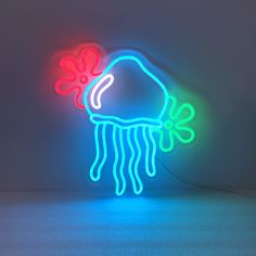 a neon sign with a jellyfish on it