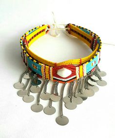 These are 100% handcrafted using fine beads, beading wire and chains. In this listing; You get 2 beaded maasai chokers(all adjustable) for USD.20 You can wear them as single necklaces or both of them. More neckleces here; https://www.etsy.com/shop/TribalTess?ref=seller-platform-mcnav&section_id=21306083 Back to my shop; https://www.etsy.com/shop/TribalTess?ref=seller-platform-mcnav Handmade Festival Jewelry For Beach, Handmade Jewelry For Beach Festivals, Large Beads Festival Choker, Festival Large Beads Choker, Yellow Beaded Choker For Festivals, Festival Choker With Large Beads, Bohemian Beaded Necklaces With Colorful Metal Beads, Handmade Beaded Choker For Festivals, Bohemian Metal Beaded Necklaces With Colorful Beads