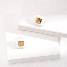 Introducing our Sterling Silver Square Drop Glaze Stud Earrings, where modern design meets classic elegance. Contemporary Square Design: These earrings feature sleek and minimalist square-shaped studs, adding a touch of modern sophistication to any outfit. The clean lines and geometric shape make them perfect for both casual and formal occasions.Glaze Finish: Each stud is adorned with a glossy glaze finish, adding a subtle shine and depth to the design. The glaze creates a smooth and polished surface, enhancing the visual appeal of the earrings and catching the light beautifully.Sterling Silver Construction: Crafted from genuine sterling silver, these earrings offer durability, shine, and hypoallergenic properties for sensitive ears. Stud Earrings Style: The stud earrings style provides a Luxury White Earrings For Everyday, Modern White Earrings For Formal Occasions, Modern White Plated Earrings, Trendy Square Earrings As Gift, Modern Enamel Earrings For Formal Occasions, Everyday White Rectangular Earrings, Trendy White Enamel Earrings, Elegant Square Tarnish Resistant Earrings, Modern White Enamel Jewelry