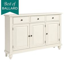 a white cabinet with four doors and two drawers