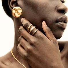 The Amali Open Ring stands out effortlessly with its subtle, soft curves. Perfect to wear solo or with your favorite ring stack. In Swahili, Amali means hope. Handcrafted by artisans in Kenya with 24k gold plated brass using traditional techniques. Maximum thickness: 0.11in (3mm) Minimum thickness: 0.07in (2mm) Height: 1in (25.4mm) Size Chart Open Ring Gold, Stackable Necklaces, Ring Stand, Stacked Earrings, Stackable Bracelets, Open Ring, Chain Choker, Favorite Rings, Selling Jewelry