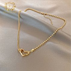 Introducing the epitome of romance and sophistication, behold the 18k Gold-Plated Heart Necklace, featuring a delicate outline of a heart pendant. This exquisite piece combines the luxurious allure of gold plating with the timeless symbolism of the heart, creating a stunning expression of love and devotion. The minimalist design of the pendant allows for effortless styling, making it the perfect complement to both casual and formal attire. Whether worn as a symbol of romantic love or as a meaningful reminder of self-love and empowerment, this necklace is sure to captivate hearts and inspire admiration wherever you go. Gold-tone Gold Plated Heart Necklace, Gold-tone Gold-plated Heart Necklace, Gold Plated Double Heart Necklace, Double Heart Rose Gold-plated Necklace, Gold Minimalist Heart Beads Necklace, Elegant Rose Gold Tarnish-resistant Heart Necklace, Valentine's Day Tarnish Resistant Heart Necklace, Luxury Gold Heart Charm Necklace, Gold Double Heart Tarnish Resistant Necklace