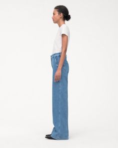 High-waisted, with a straight leg fit, these pants have a slimming effect enhanced by elongating front seams extending from thigh to ankle. A double hook and bar closure with an interior button provide a clean finish in the front, while the back is fit to provide lift and shape.Our denim is made from organic cotton processed in a GOTS-Certified Italian mill. We’ve invested in working with a responsible denim mill that measures their impact and uses data to push the industry forward. They’ve deve Relaxed Fit Denim Blue Flare Jeans For Work, Modern Medium Wash Full Length Bottoms, Modern Full-length Bottoms In Medium Wash, Classic Full Length Relaxed Fit Jeans, Modern Full-length Medium Wash Bottoms, Modern Full Length Medium Wash Bottoms, Light Wash Tapered Leg Work Bottoms, Classic Light Wash Tapered Leg Bottoms, Denim Blue Wide Leg Flare Jeans With Seam Detailing