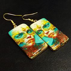 These image transfer earrings are ready to ship.  The earrings are handcrafted from polymer clay and uses my own image transfer technique. They have a top layer of resin.  I have only one pair of these earrings. Artsy White Resin Earrings, Artistic White Resin Earrings, Handmade Artistic Rectangular Earrings, Artistic Handmade Rectangular Earrings, Hand Painted Resin Earrings For Gifts, Hand Painted Resin Earrings As Gift, Unique Hand Painted Earrings For Gift, Artistic Hand Painted Gold Earrings, Artsy Nickel-free Polymer Clay Earrings