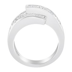 This asymmetrically designed cocktail ring will be the most unique piece you have in your jewelry collection. Crafted in the finest 14k white gold, this ring has an overlapping band that is set with beautiful princess and baguette-cut diamonds. The channel and invisible set diamonds shine in this piece that has an impressive total carat weight of 2 cttw. This is the perfect piece for any formal occasion. Modern Rings With Baguette Diamonds, Modern Silver Diamond Ring With Baguette Diamonds, Designer Rings With Brilliant Cut For Everyday Luxury, Modern Open Ring With Baguette Diamonds, Modern Rings With Baguette Diamonds For Formal Occasions, Modern Baguette Diamond Rings For Formal Occasions, Modern Baguette Cut Rings For Everyday Luxury, Luxury Silver Bypass Ring, Luxury Bypass Ring With Polished Finish