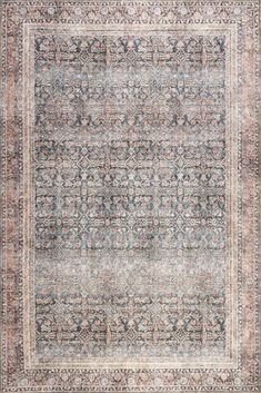 an antique rug with blue and beige colors