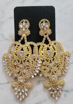 Dainty girls...keep scrolling! These Sasha Chandelier Earrings are large, fierce and of course very GLAM. Dripping in clear or champagne colored stones, these statement earrings are gorgeous enough for some evening time or holiday glam look, and versatile enough to Glam up your daytime looks. ** gold w/ gold available as preorder to be shipped week of 12/12 ** Big Earrings Statement, Jewelry 101, Chandelier Earrings Gold, Evening Time, Glam Earrings, Gold Chandelier Earrings, Engagement Proposal, Holiday Glam, Gold Pendant Jewelry