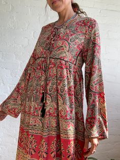 "This is cute oversized boho maternity dress,  made in upcycled saree silk, that feels light and soft.  It is made baggy and loose  fit all sizes S-L perfect tunic for summer days, for ladies who appreciate comfort  MEAESURE:: size S-L shoulder 18\" bust up to 41\" high waist up to 40\" length 49\" MATERIAL * 70% silk * 30 %poliester * no, lining CARE INSTRUCTIONS  * Wash in warm water * Hand wash recommended * Hang to dry  IMPORTANT NOTE  * Please note that colour shown on your monitor may vary Flowy Long Sleeve Midi Dress With Paisley Print, Flowy Long Sleeve Paisley Print Midi Dress, Bohemian Flowy Maxi Dress With Bell Sleeves, Flowy Bohemian Maxi Dress With Bell Sleeves, Flowy Bohemian Midi Dress For Fall, Bohemian Flowy Bell Sleeve Maxi Dress, Bohemian Printed Tunic Maxi Dress, Flowy Boho Print Midi Dress In Rayon, Long-sleeved Flowy Dress With Tassels