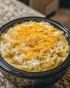 Put uncooked elbow macaroni in the slow cooker with these 2 ingredients. The end result is pure decadence!