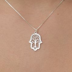 New! New! Beautiful silver Tree of life Hamsa necklace set on a dainty and feminine silver chain.. ~~Necklace measurements on model is 16inch~~ size 1.5X2cm 0.59X0.78inch This necklace will be Packed perfectly in a gift box with an organza bag. Also ready for giving as a gift. View more dainty Necklaces ~ https://www.etsy.com/il-en/shop/DoronJewelry?section_id=16043125&ref=shopsection_leftnav_1 https://www.etsy.com/il-en/shop/DoronJewelry?ref=shopsection_shophome_leftnav GIFT IT I can ship t Sterling Silver Tree Of Life Jewelry, Symbolic Sterling Silver Tree Of Life Jewelry, Symbolic Tree Of Life Sterling Silver Jewelry, Spiritual Sterling Silver Jewelry With Tree Of Life, Symbolic Silver Necklace With Tree Of Life, Spiritual Tree Of Life Sterling Silver Necklace, Silver Tree Of Life Necklace For Jewelry Making, Necklace Measurements, Necklace Tree