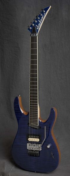 an electric guitar with a blue body and neck