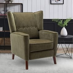 a living room with a brown chair and white rug