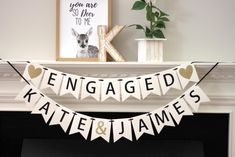 a white banner that says engaged kate and james hanging from a mantel above a fireplace