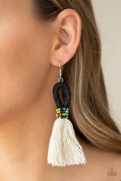 A tassel of soft white cotton fans out under rows of brightly colored seed beads. Anchored by a loop of jet black floss, the eye-catching style swings from the ear for a show-stopping statement. Earring attaches to a standard fishhook fitting.

 Sold as one pair of earrings. Live Text, Trendy Fringe, Black Earring, Feather Fan, Macrame Earrings, Statement Earring, Black Oil, Paparazzi Accessories, Black Fringe